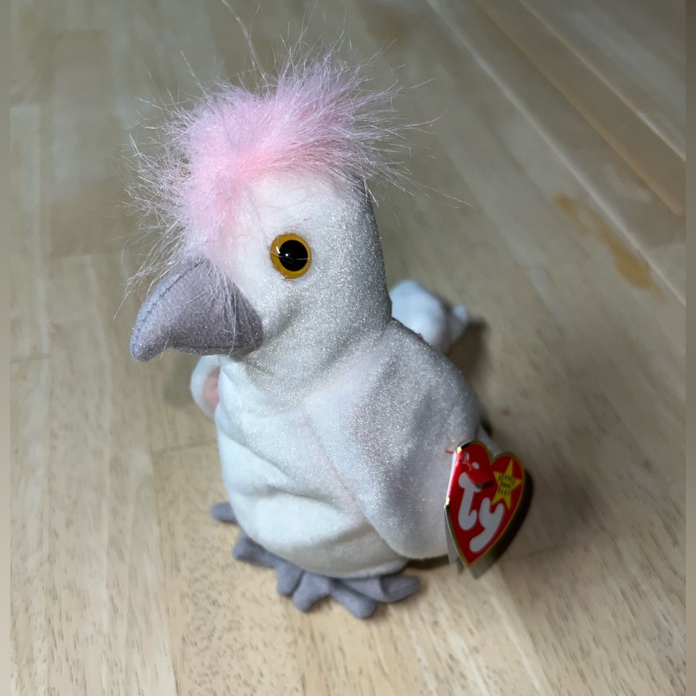 Ty Beanie Baby “Kuku.” Perfect condition, stored in plastic.